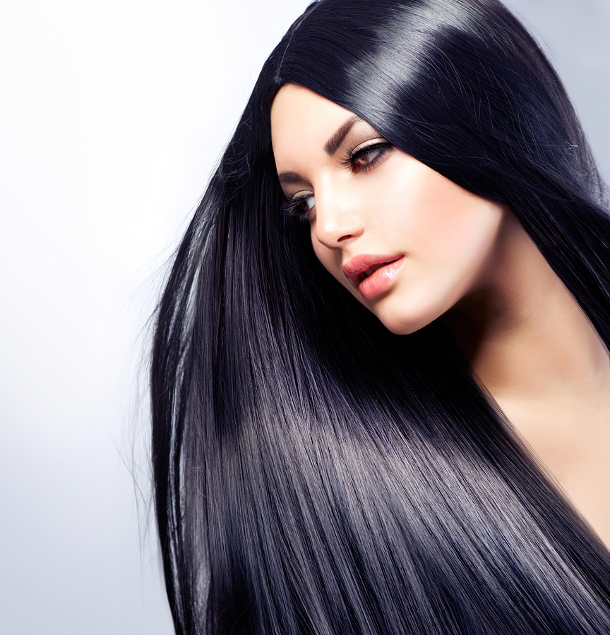 A lady with luscious black hair and brown eyes