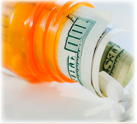 A pill bottle with money wrapped in it and a few pills spilling out