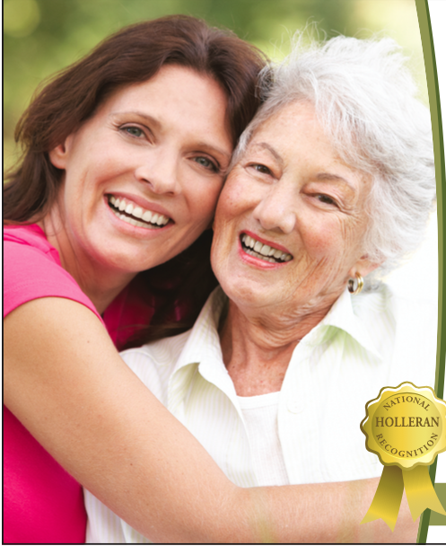 A lady and her mother hugging and smiling
