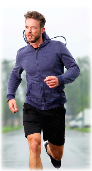 A man mid run, looking into the distance