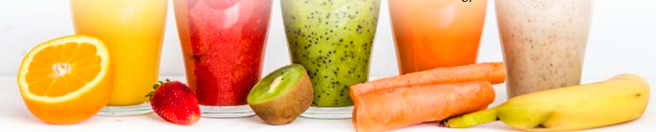 Fruits and their corresponding juices in glasses