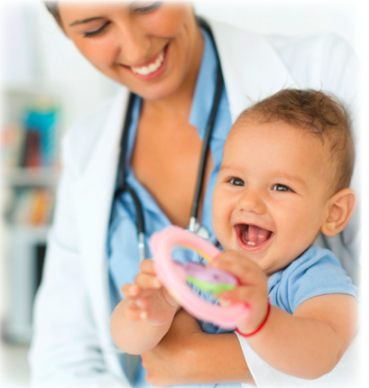 A doctor holding a baby while they are playing with a toy