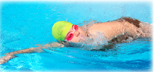 A person mid stroke in a swimming pool