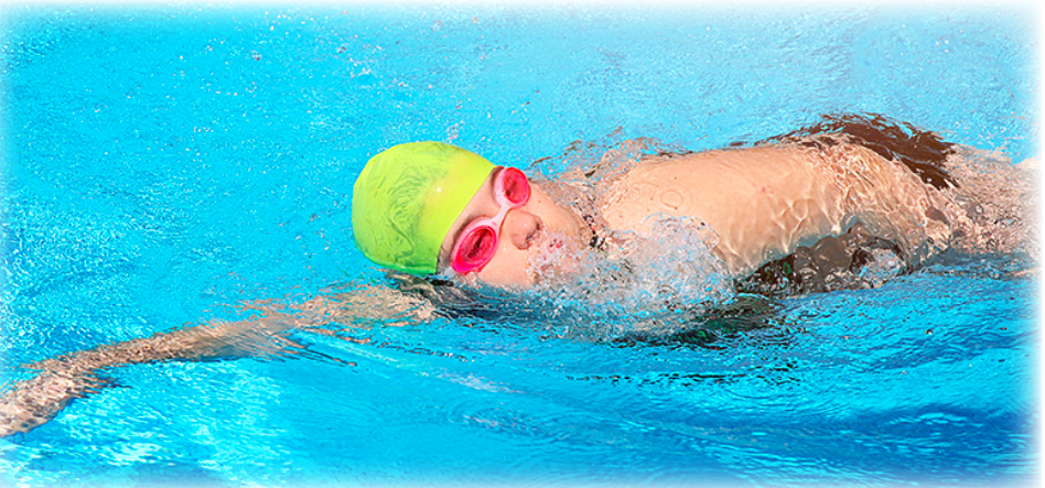 A person mid stroke in a swimming pool