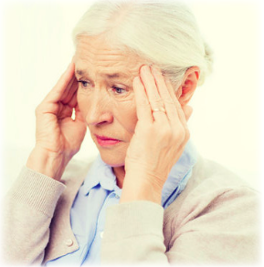 An older lady gripping her temples in confusion