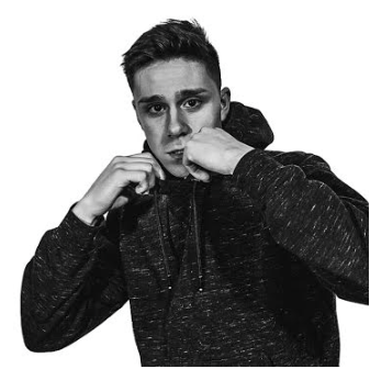 A man with his hands covering his face in a fighting stance
