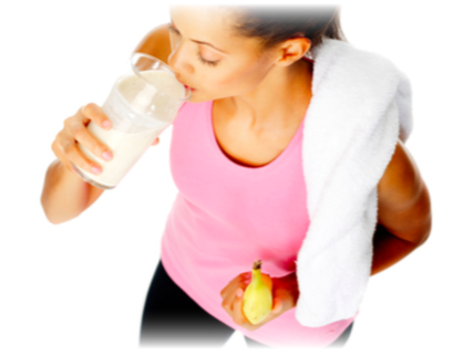 A lady post workout drinking a smoothie and eating a banana