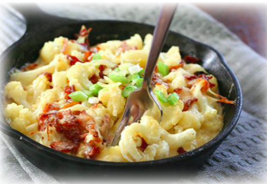A plate of carb free cauliflower cheese and bacon casserole