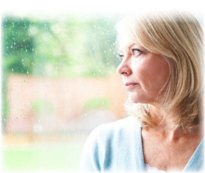 A women staring out of her window, pondering