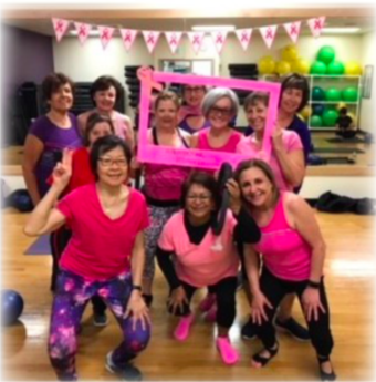Women gathering together to raise awareness about breast cancer