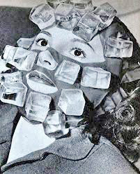 A girl sitting with a mask covered in ice on her face