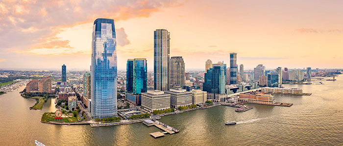 An Aerial panorama of Jersey City skyline at sunset.