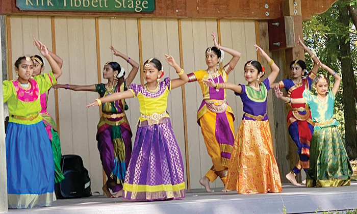 A group of authentic indian dancers mid-dance