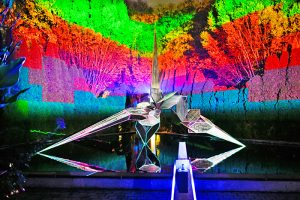 An AI looking image, filled with rainbows of color and a prism in the middle