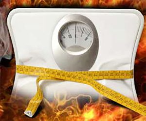 A picture of a scale with fire around it