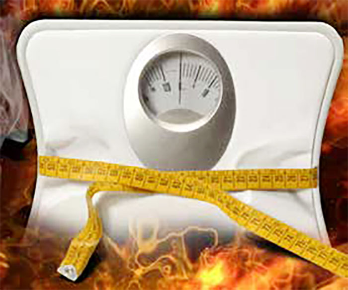 A picture of a scale with fire around it