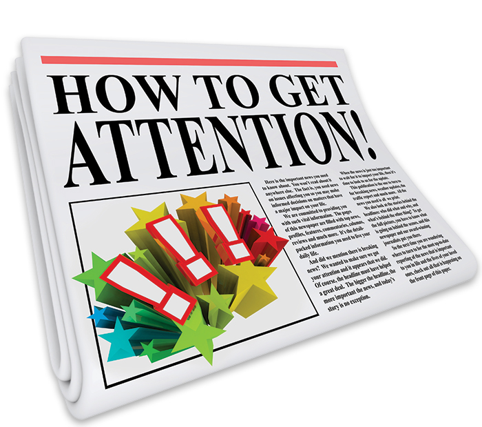 A newspaper with the headline, How to Get Attention!