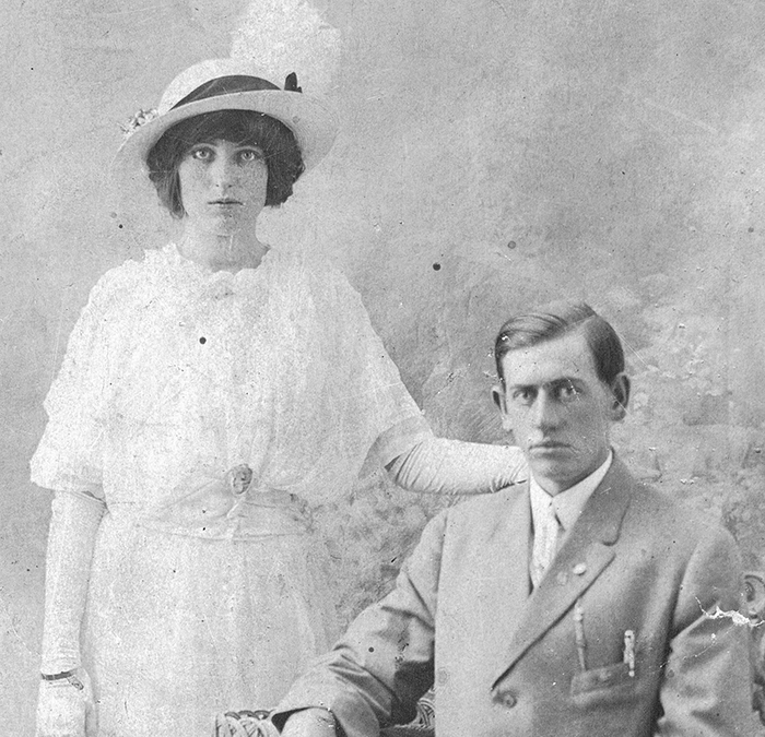 A Black and white, old photo of a couple.